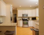 Excellent prep area includes the range with microwave and a large side by side refrigerator